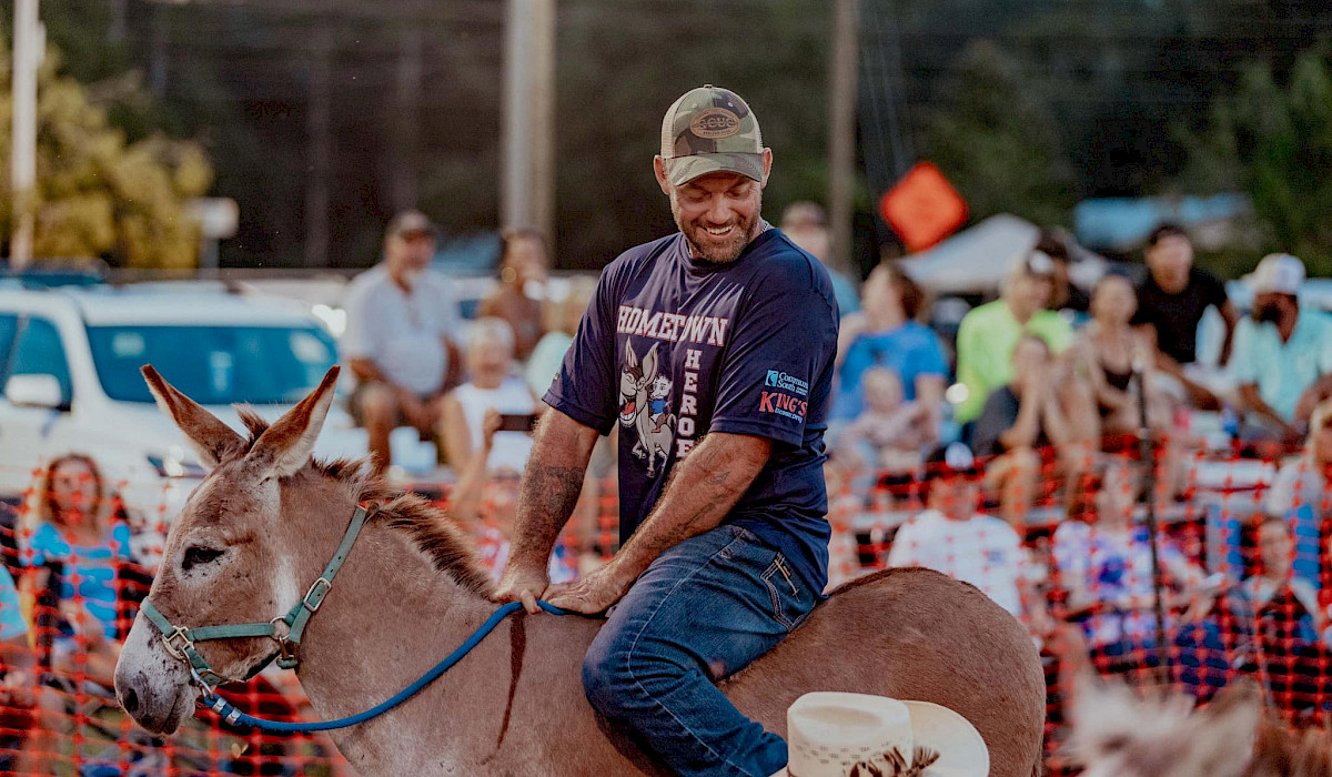 player riding a donkey